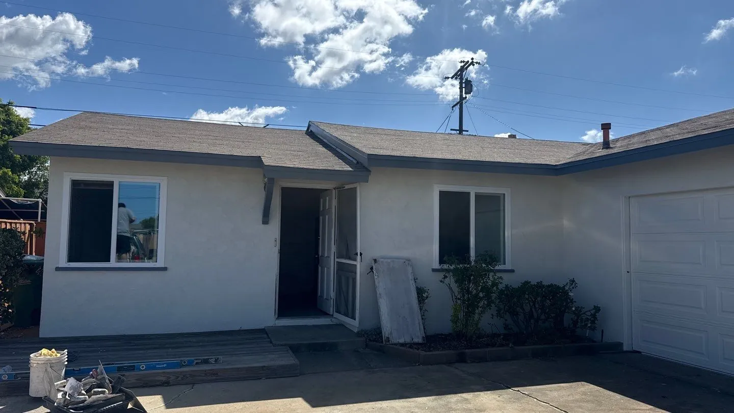 Clairemont ranch home after the renovation in white with charcoal trim