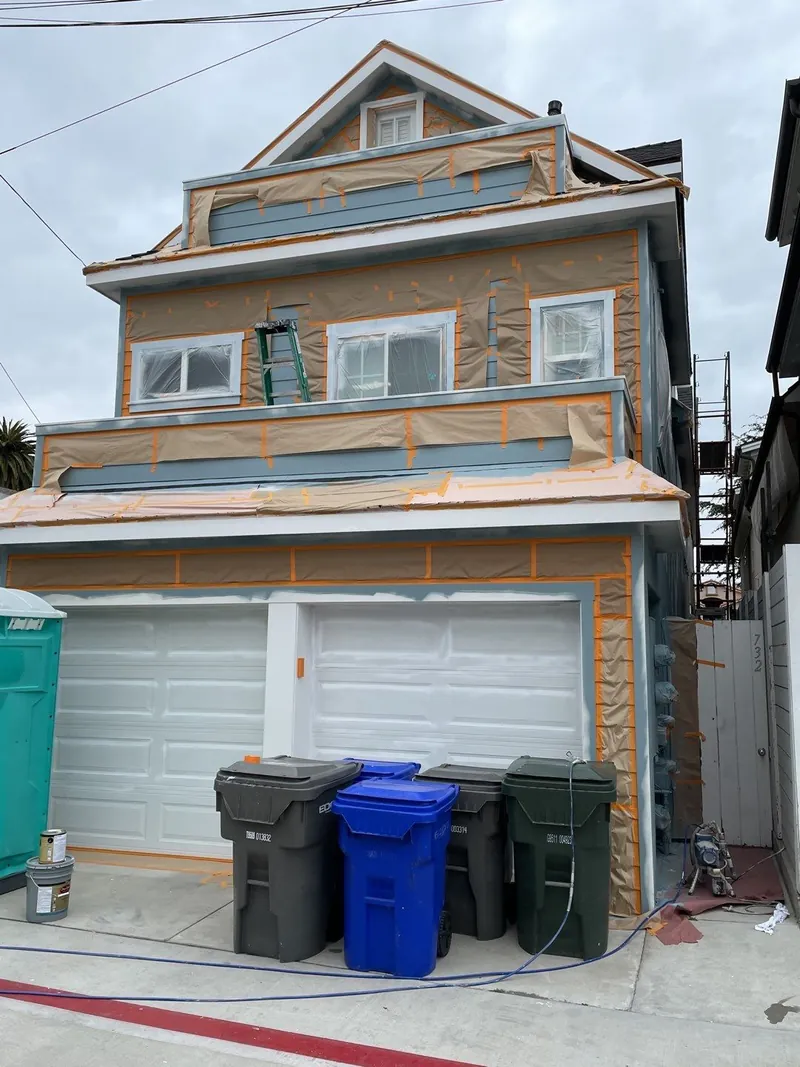 Front of a narrow Coronado home fully primed before color coats