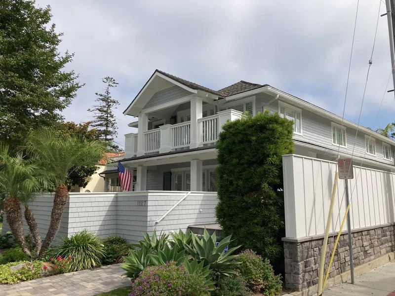 New fence and freshly painted two-story home in Coronado