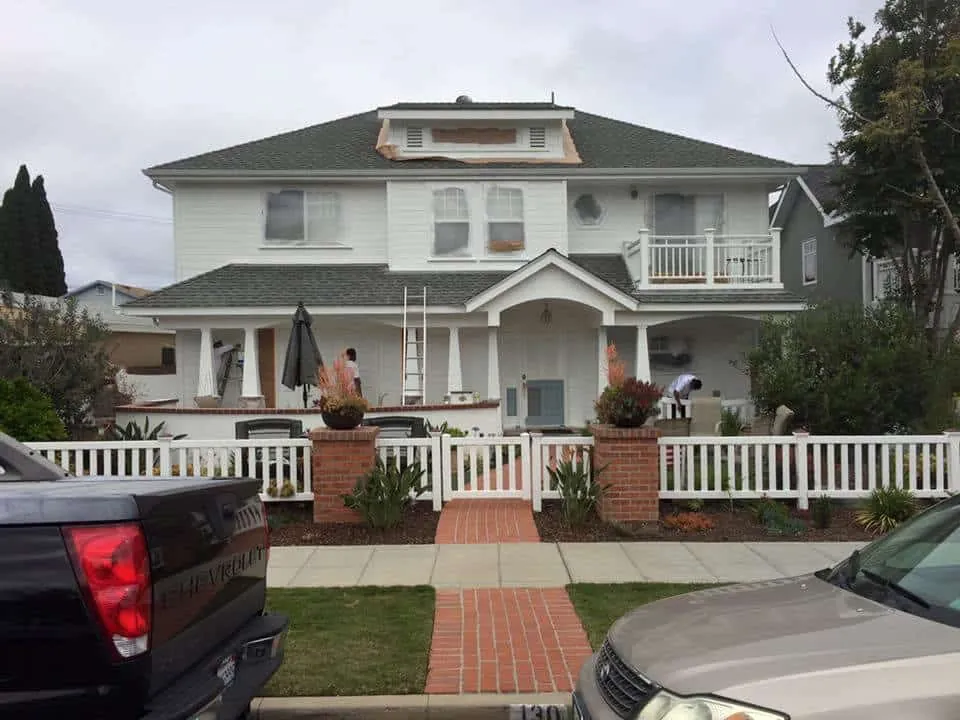 Two-story craftsman home in Coronado painted all white