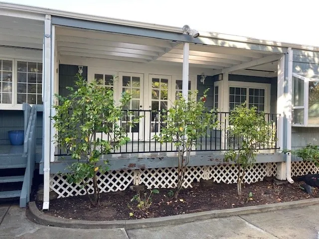 Covered porch and lattice before exterior restoration