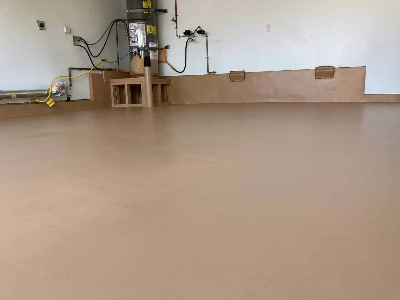 Garage floor finished with a tan epoxy coating