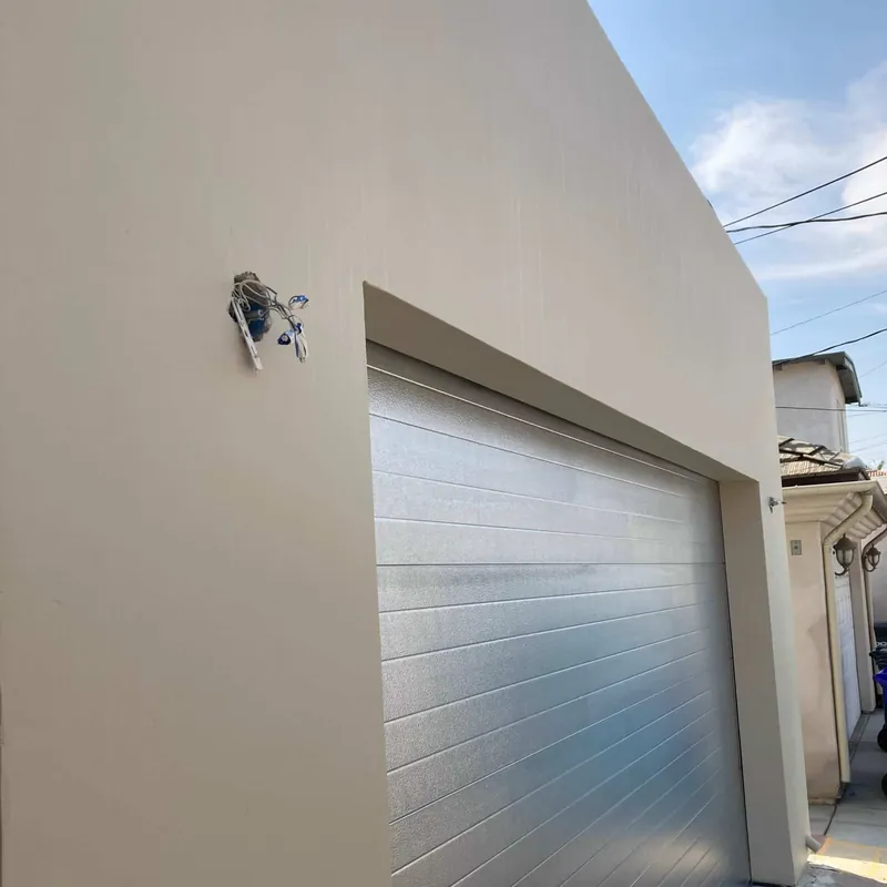 Smooth stucco exterior and garage after painting in Coronado