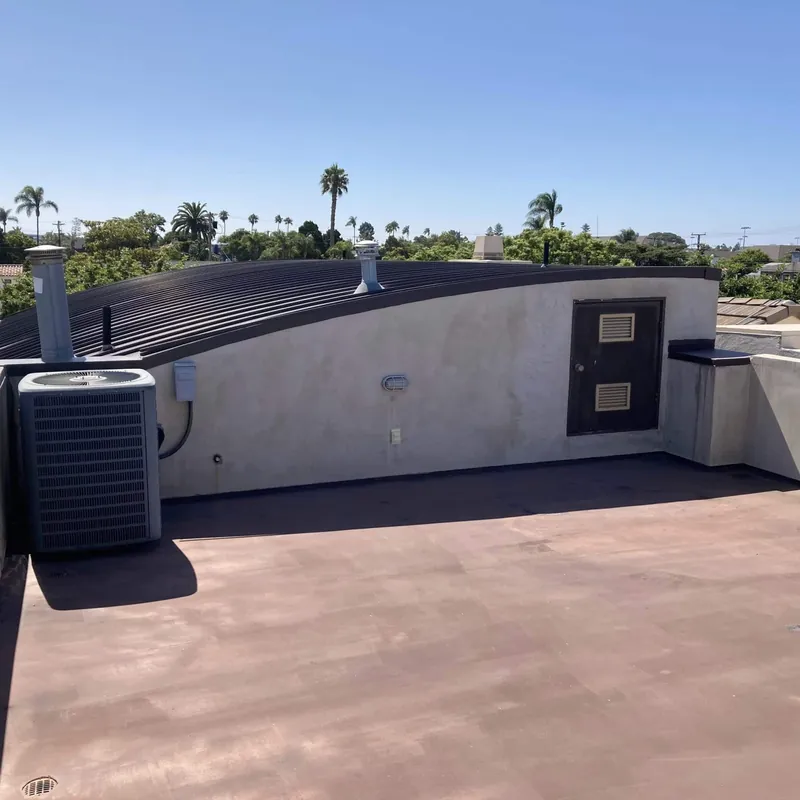 Rooftop deck before repairs and a new deck coating