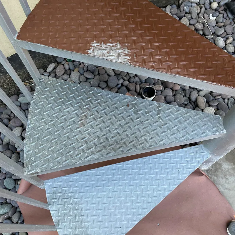 Diamond-plate stair treads being refinished