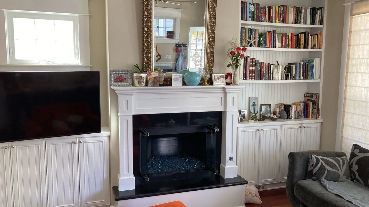 Living room built-ins and fireplace surround painted white