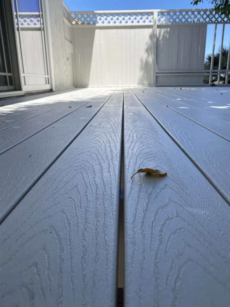 Freshly painted deck boards on a second-story deck