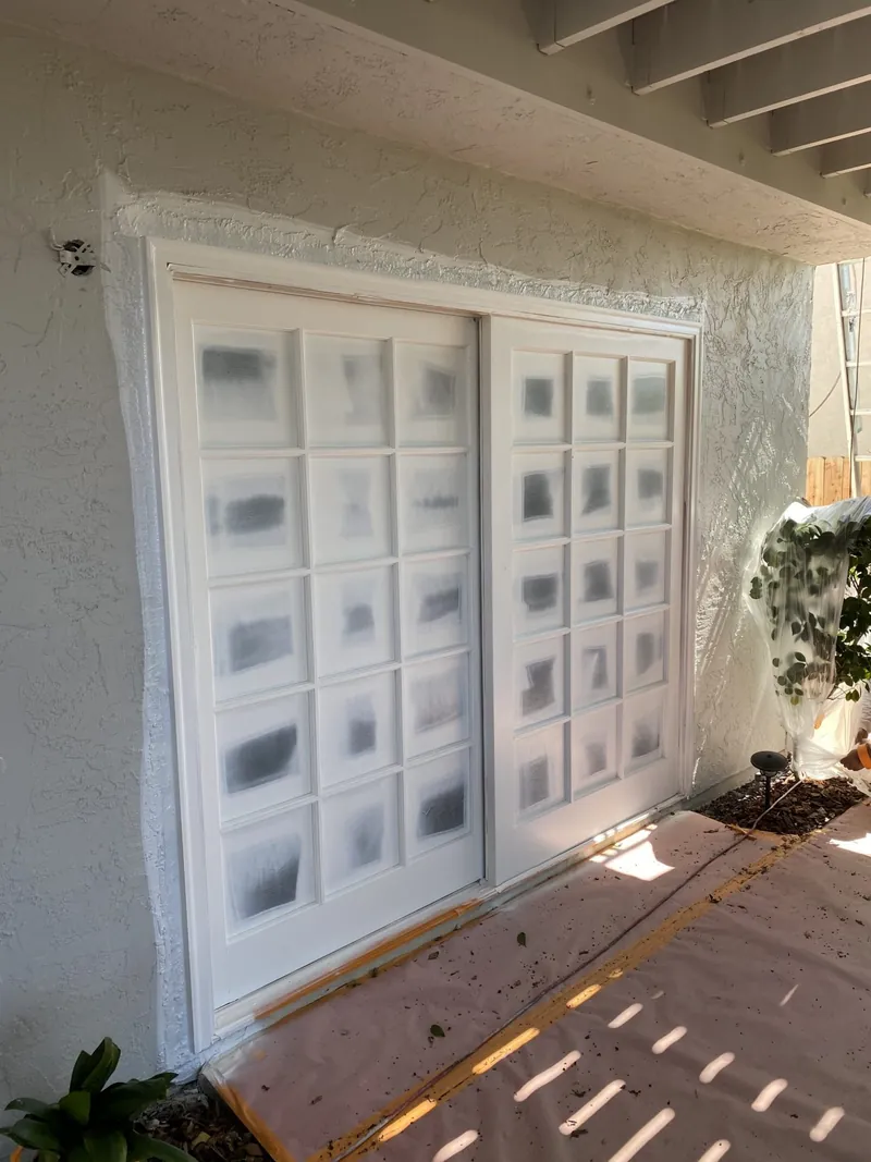 Garage door panels masked for spraying