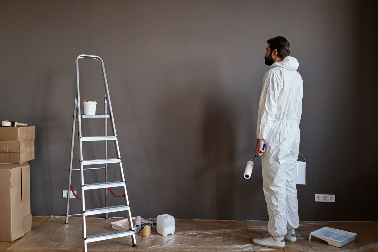Residential Painters in San Diego preparing wall with dark fall-inspired paint
