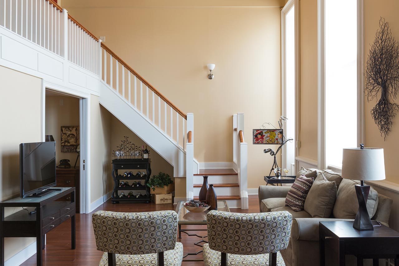 Cozy modern living room with warm fall-inspired paint colors, ideal for fall interior painting projects